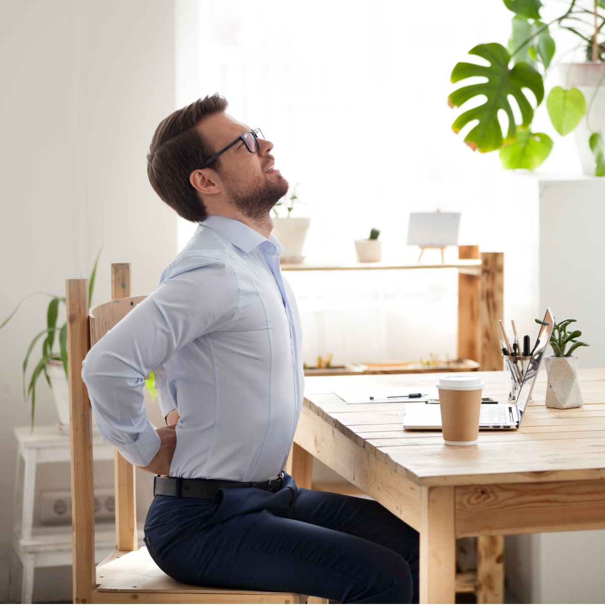 man doing a stretch on chair