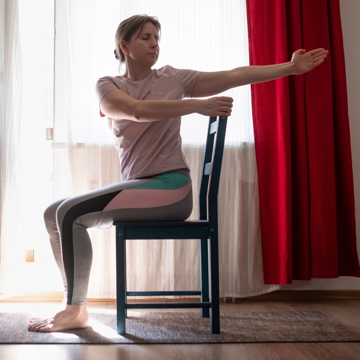 woman twisting on chair