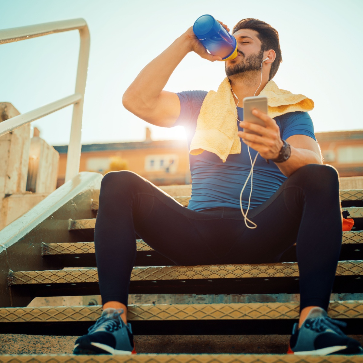 man drinking sports drink