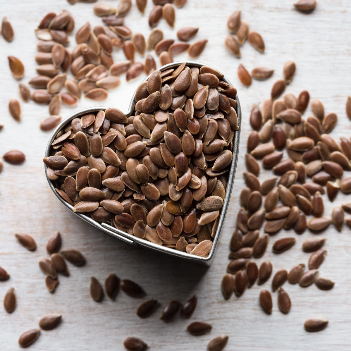 flaxseeds in a heart shaped cup