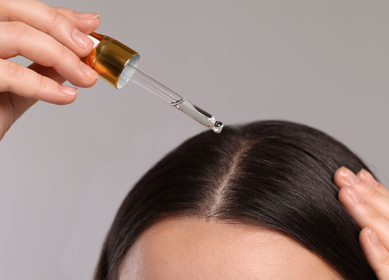 dropping-hair-oil-onto-scalp