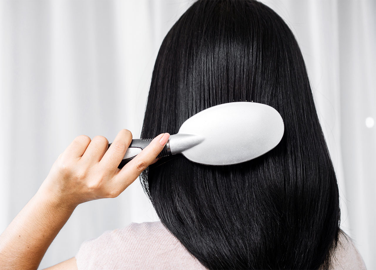 woman-brushing-black-hair
