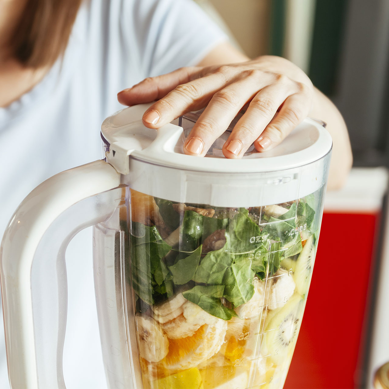 woman blending smoothie