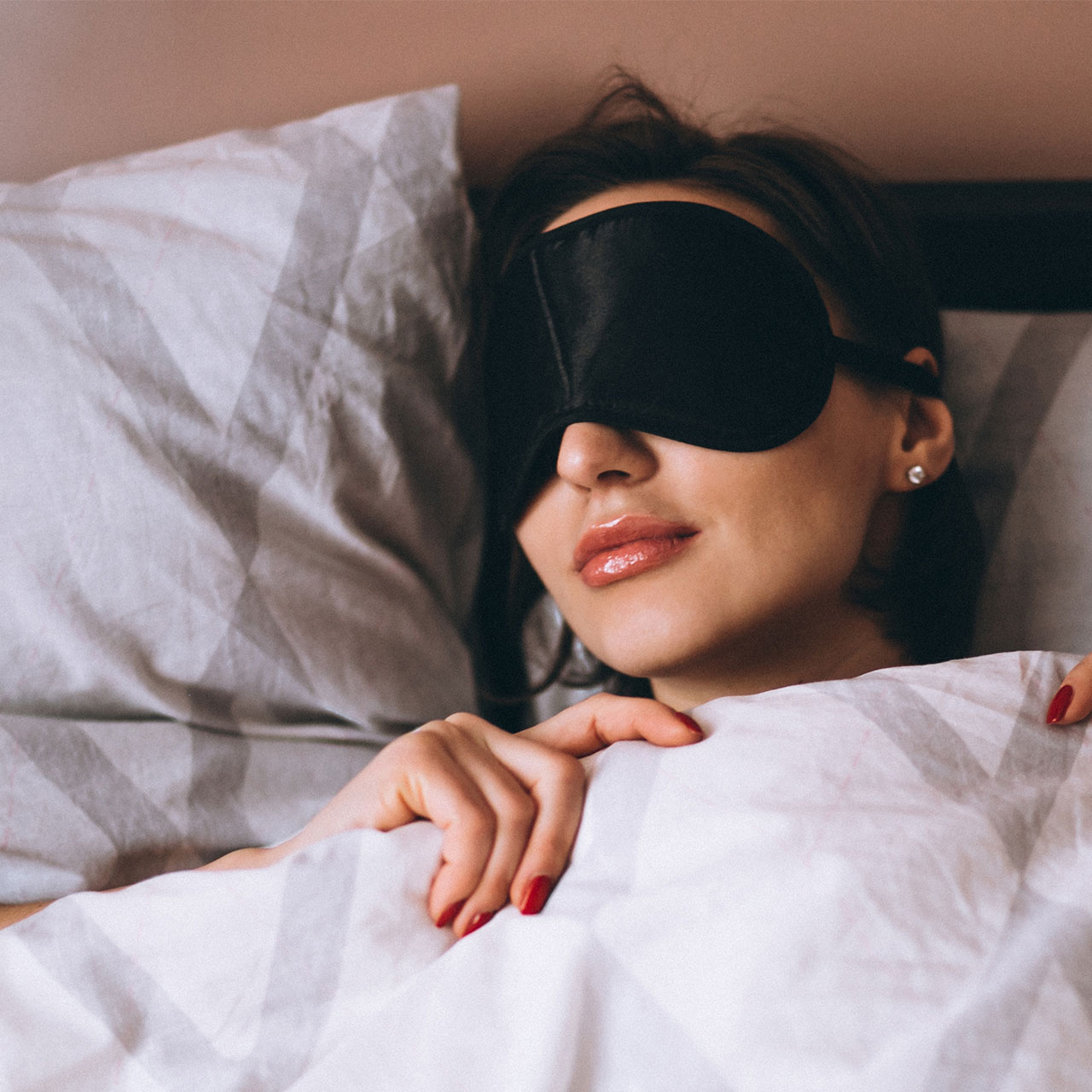 woman sleeping in eye mask