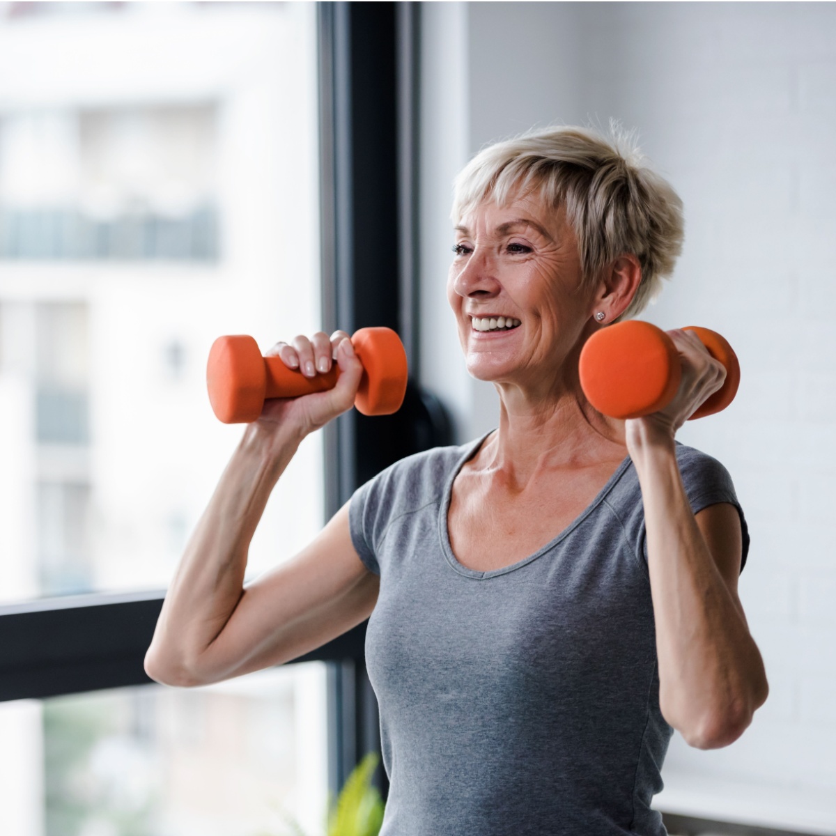 older woman lifting weights