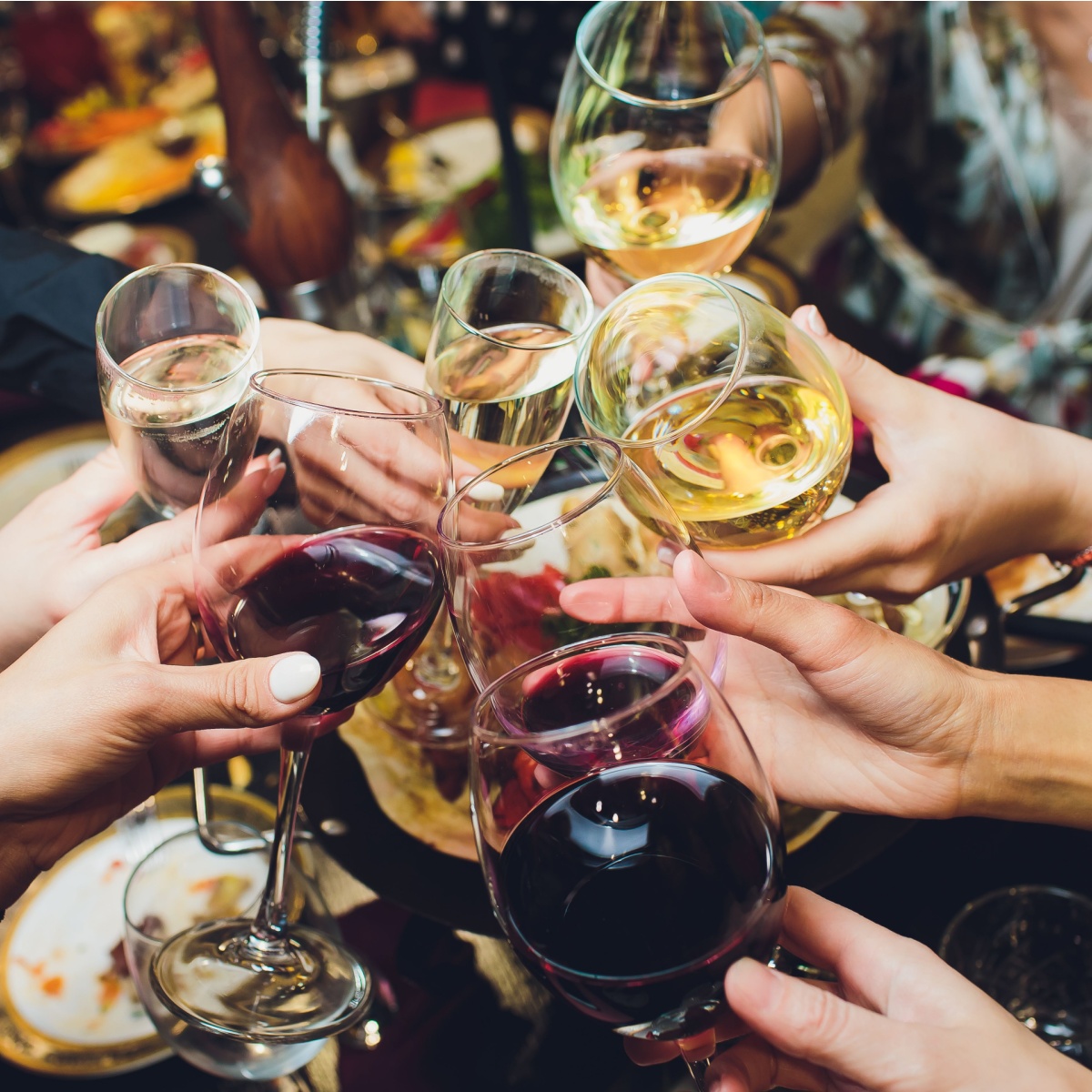 group of people doing cheers with alcohol