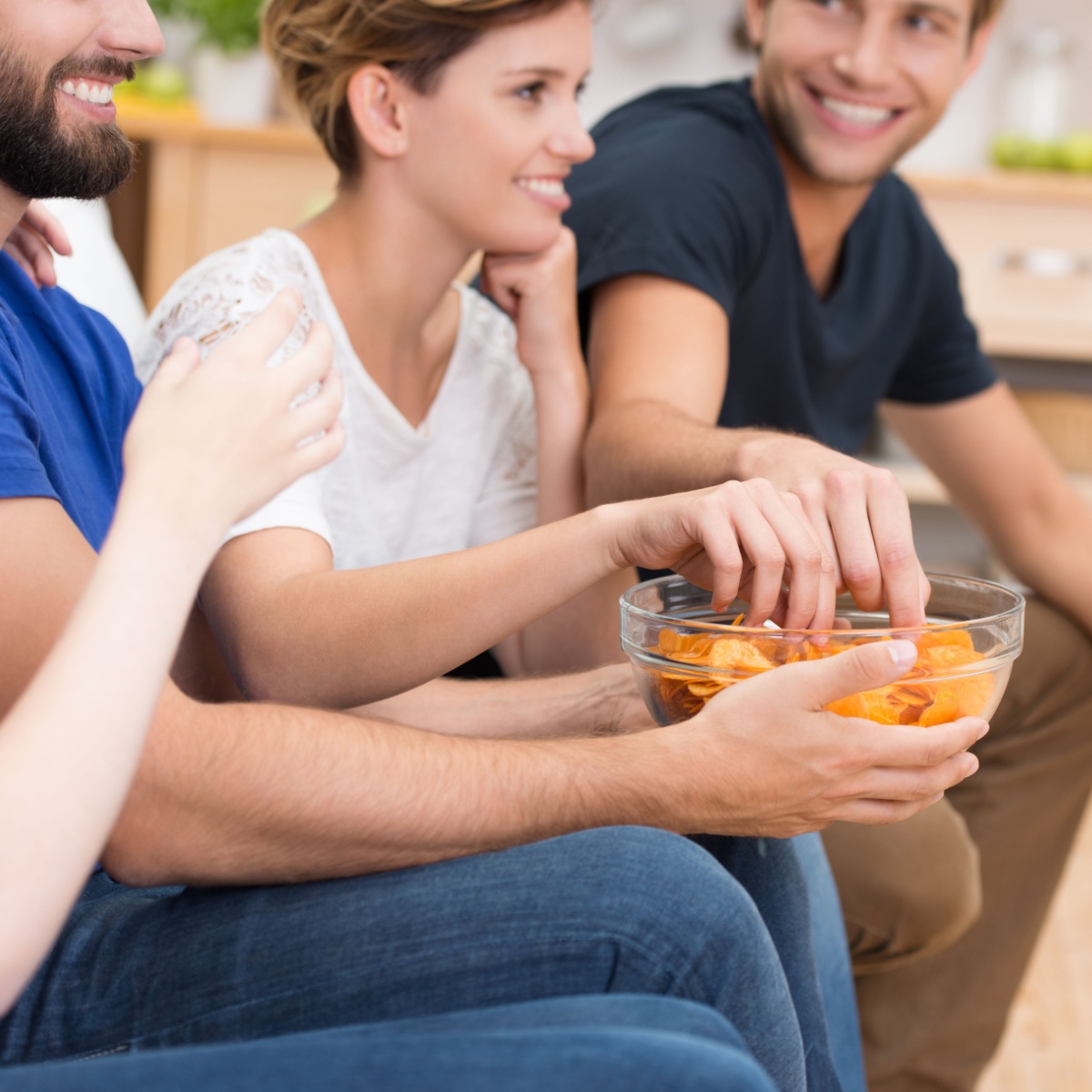 group of friends eating potato chips