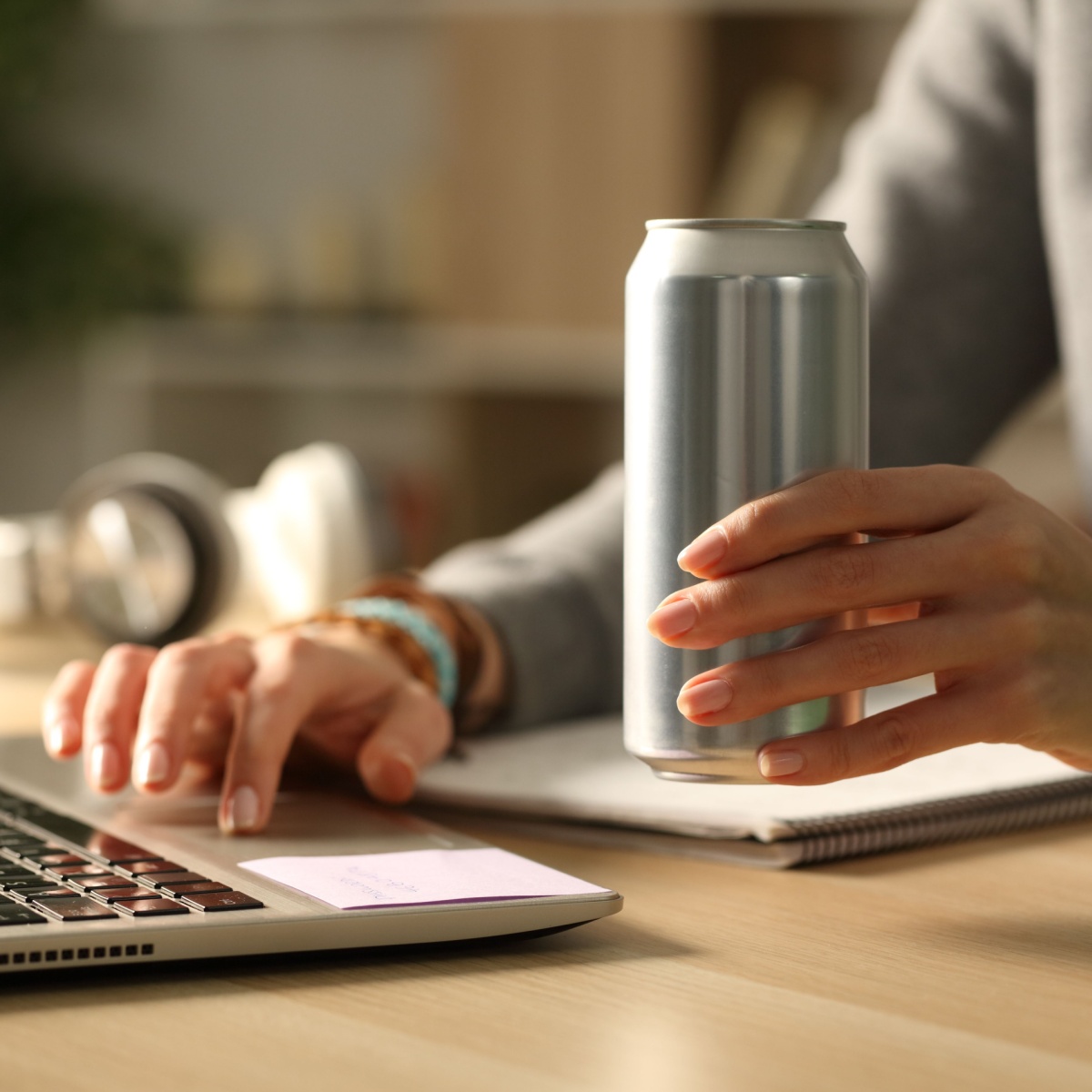 woman holding can in her hand