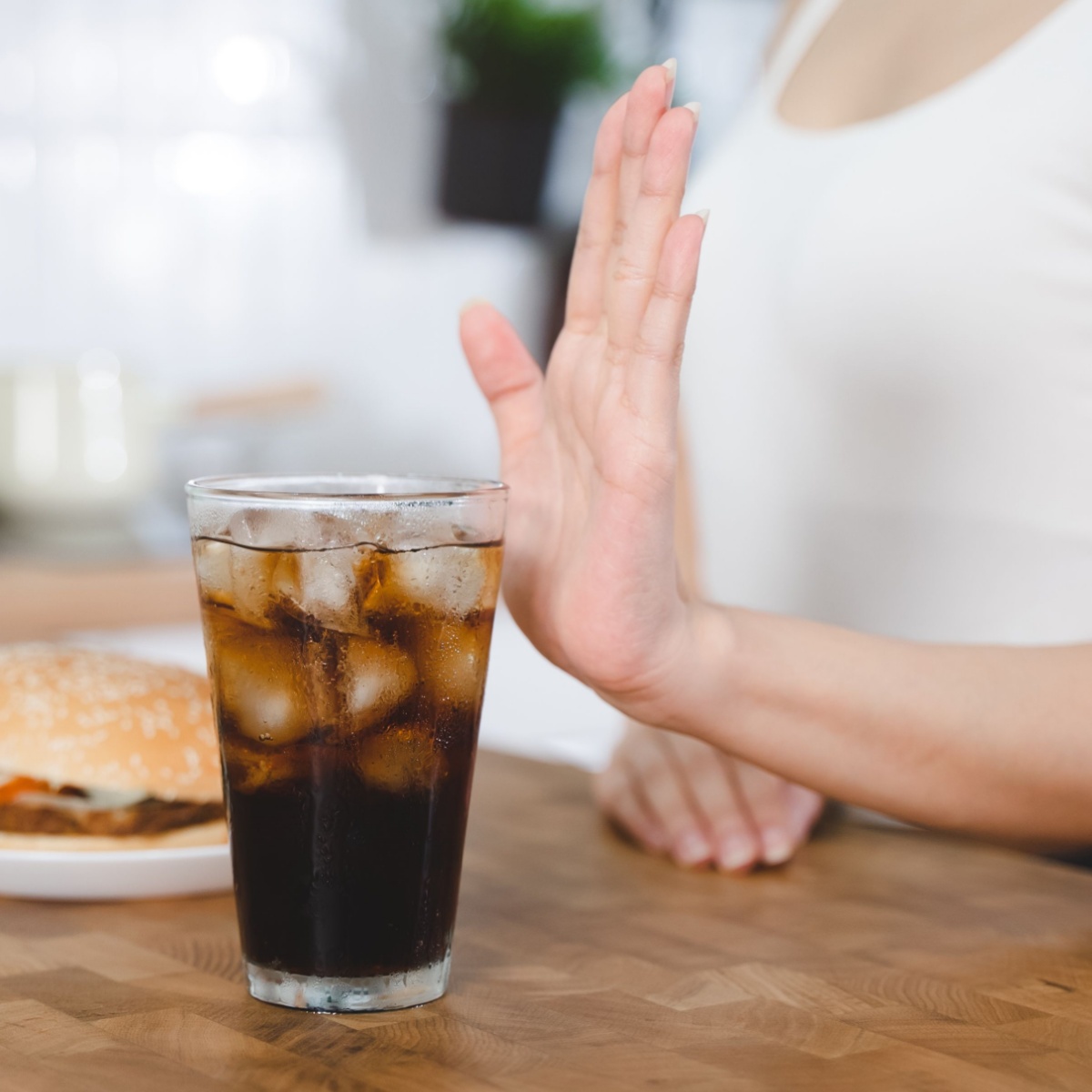 woman refusing soda