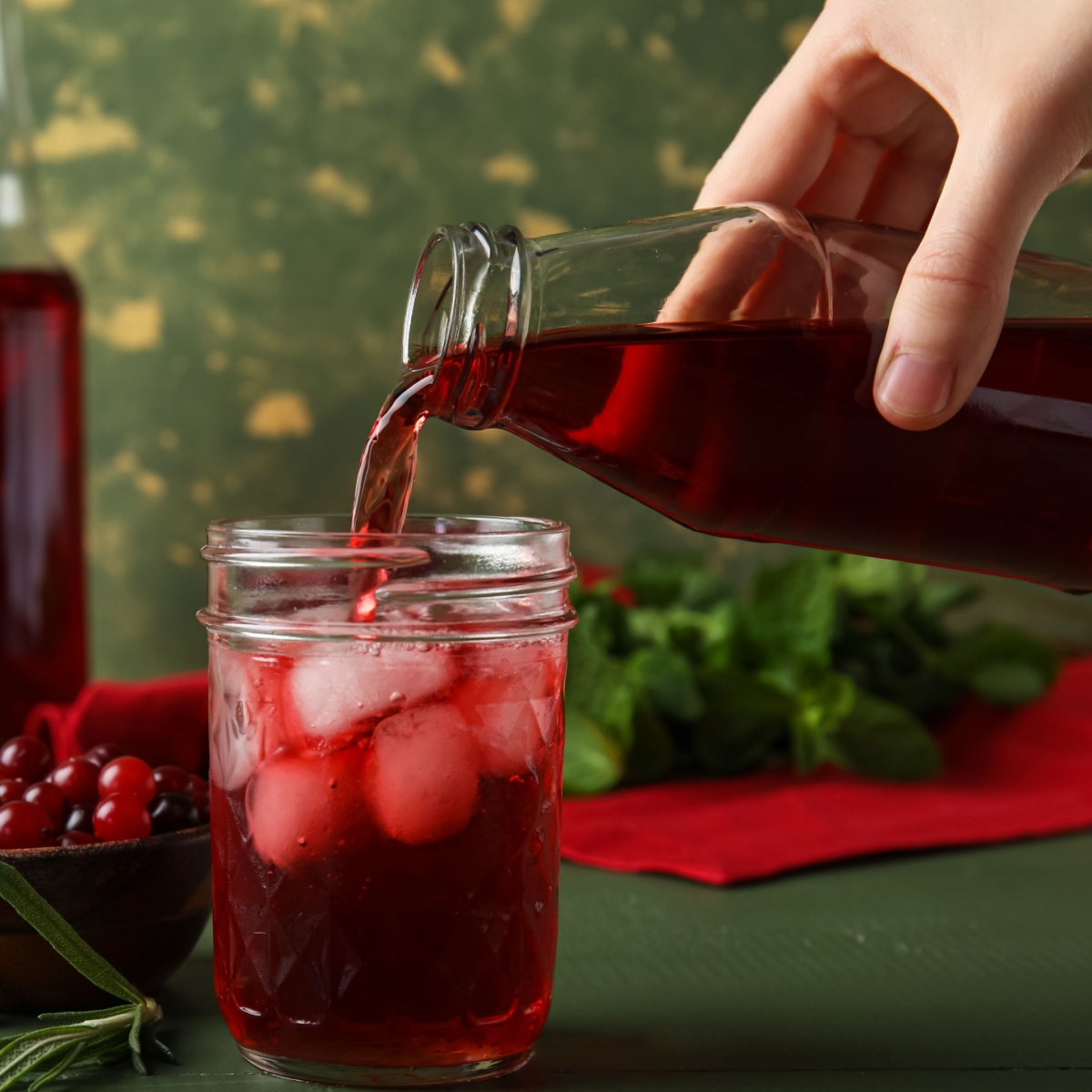 red juice being poured in a glass