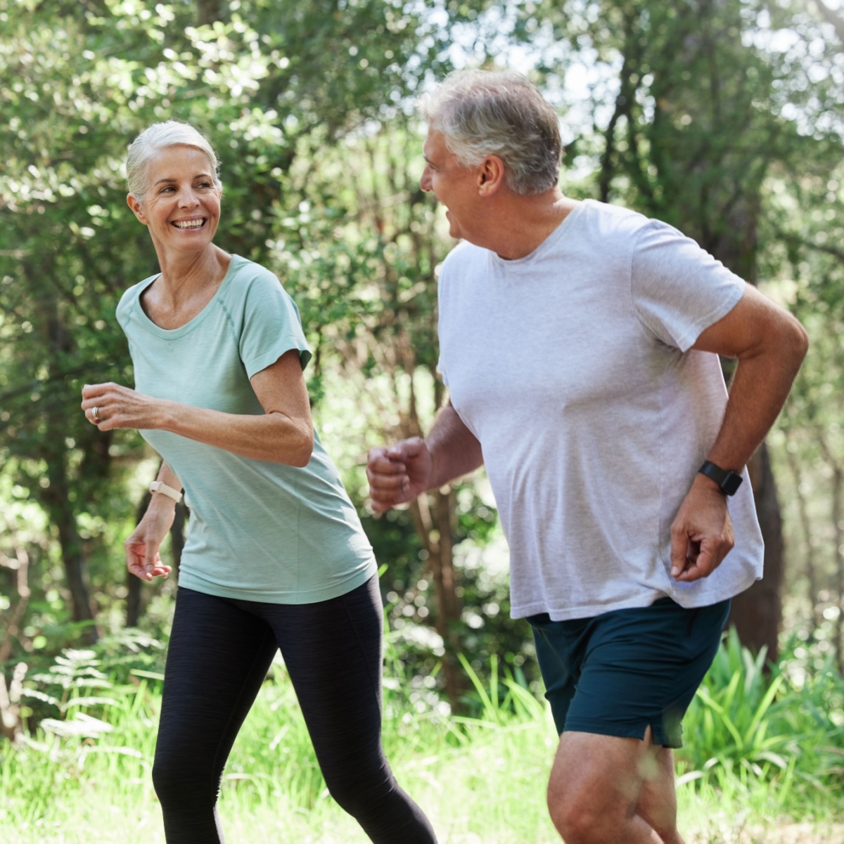 older man and woman running