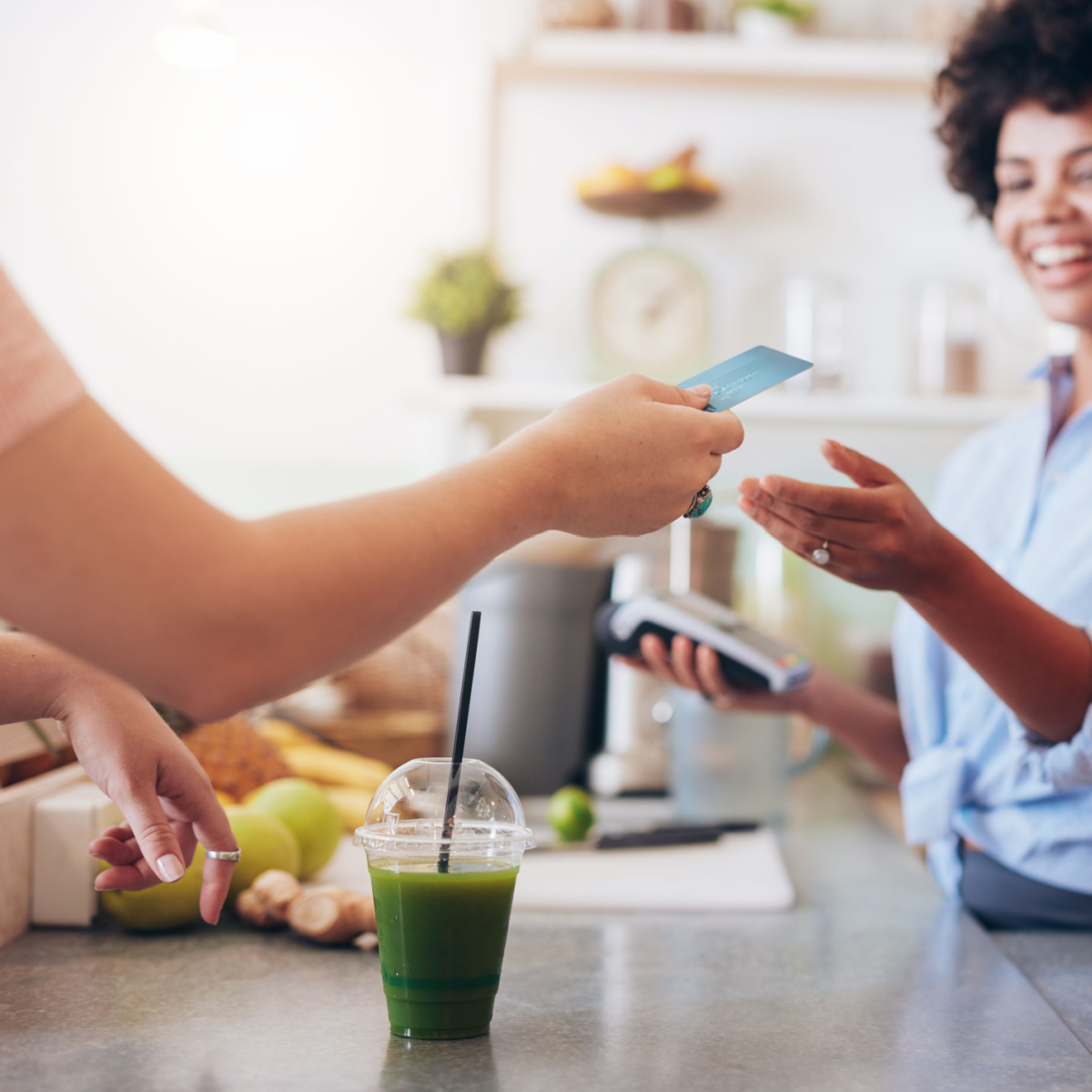 woman buying a smoothie