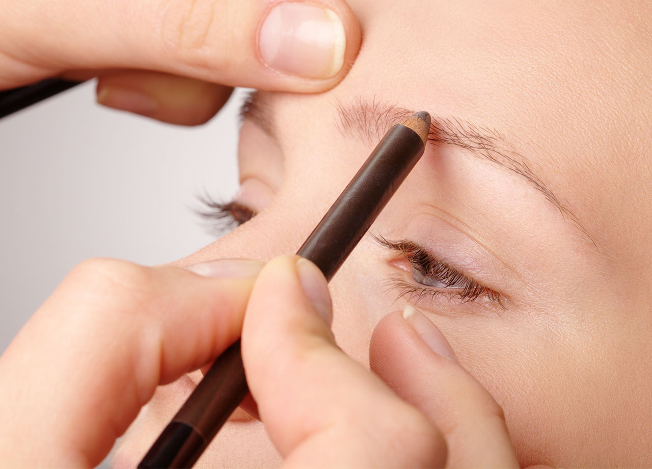 woman-getting-brows-groomed