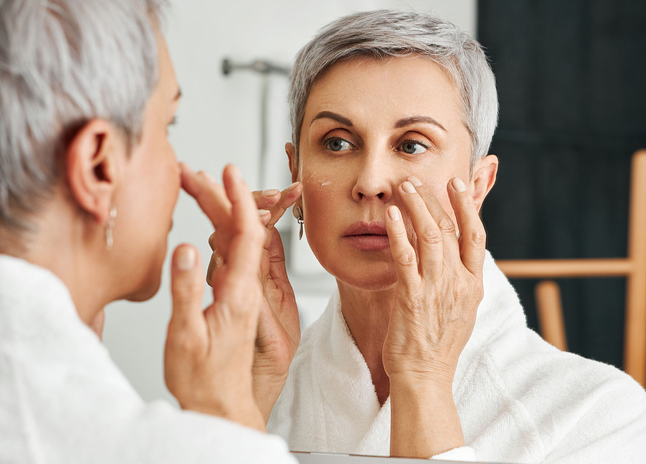 older-woman-looking-in-mirror