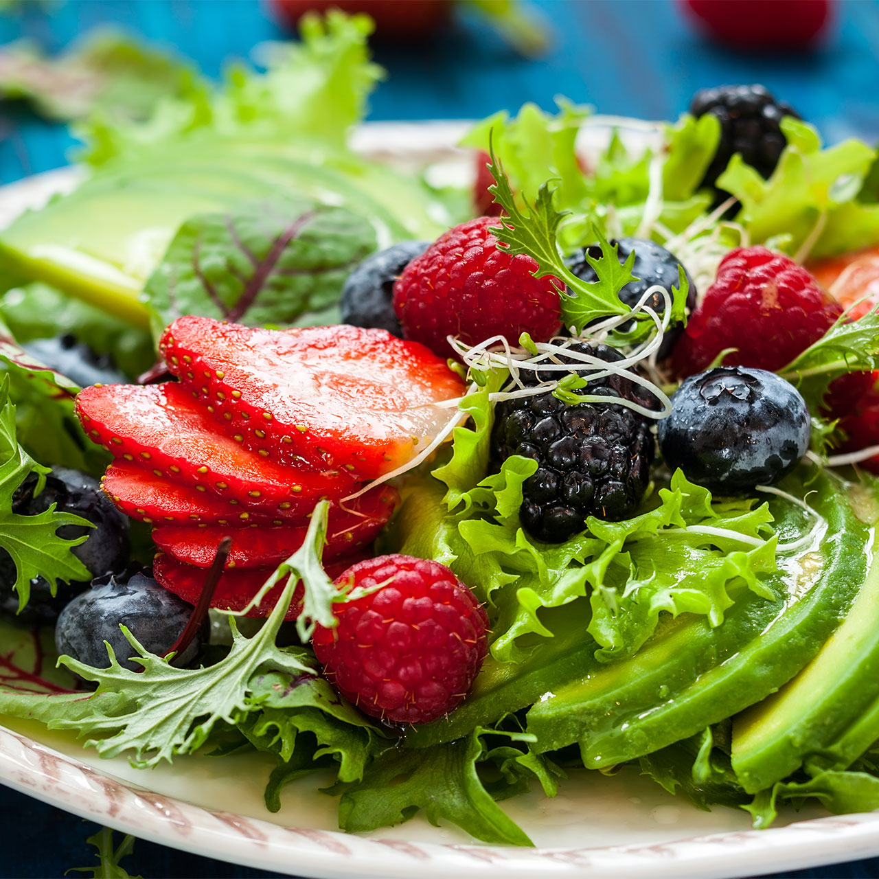 salad with berries and avocado