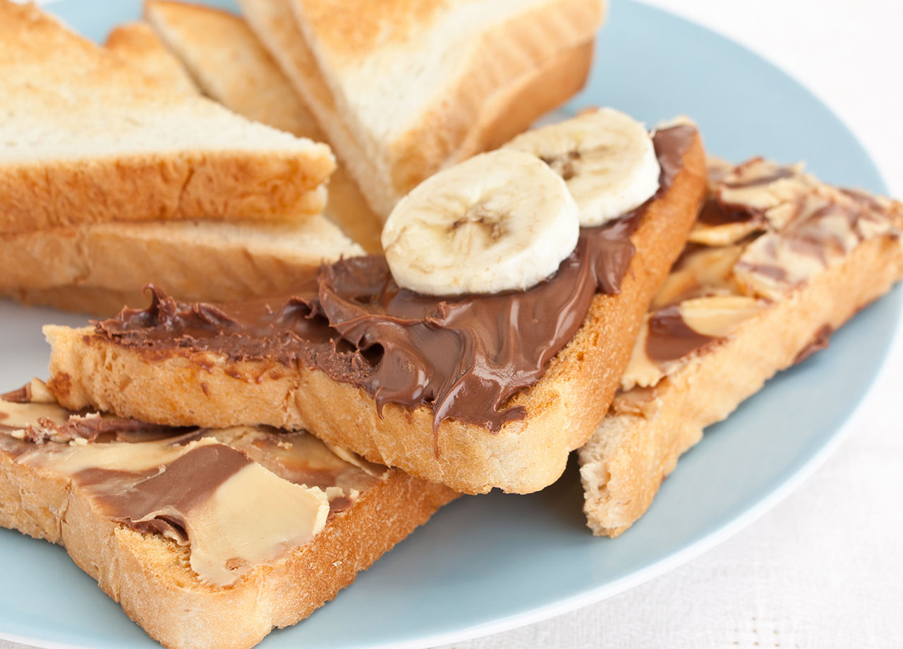 toast with bananas and peanut butter and chocolate spread