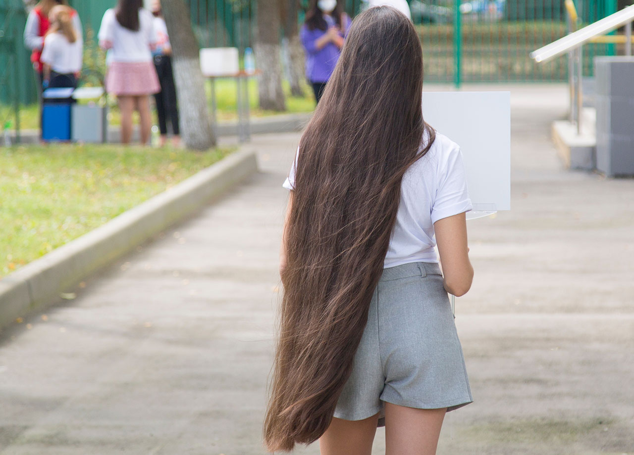 anonymous woman with extremely long hair