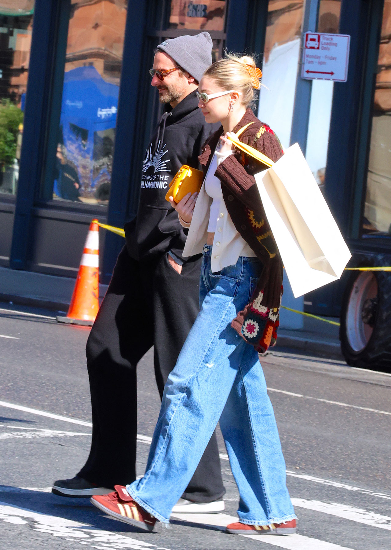 gigi hadid and bradley cooper walking down street