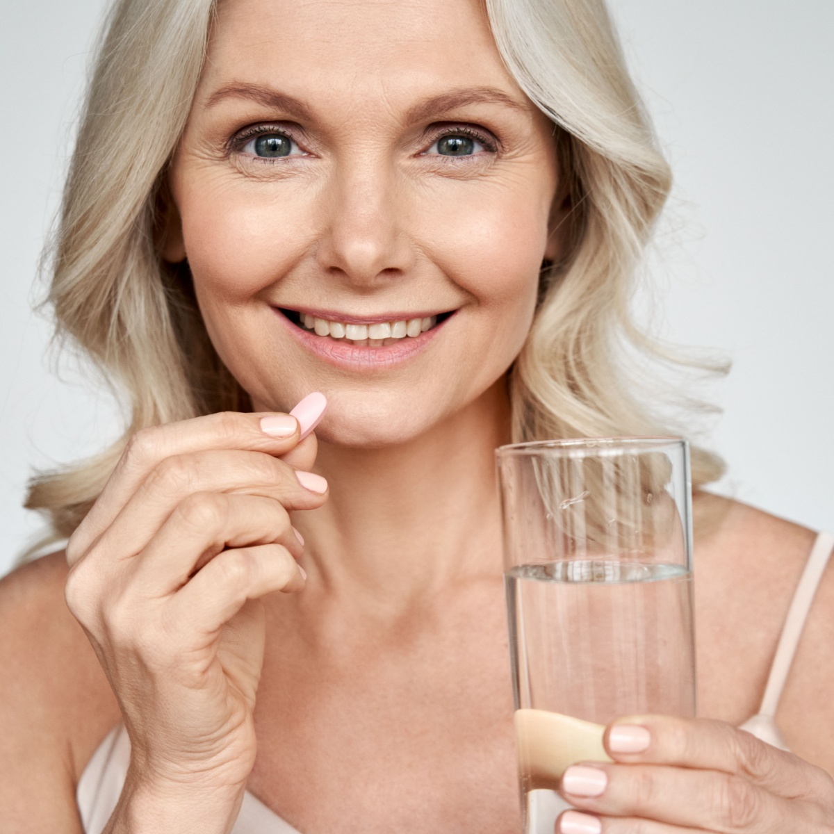 woman taking supplement