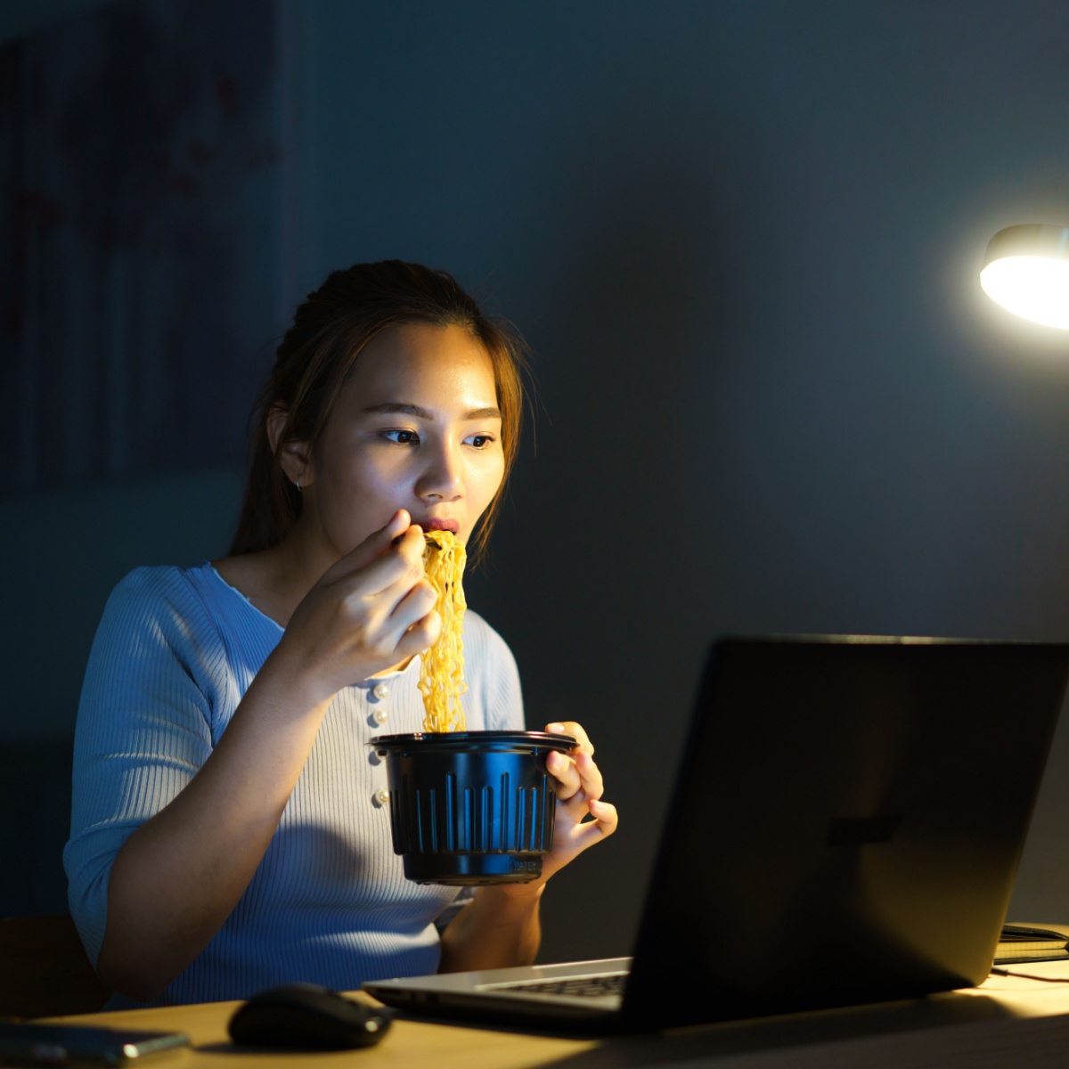 woman eating ramen