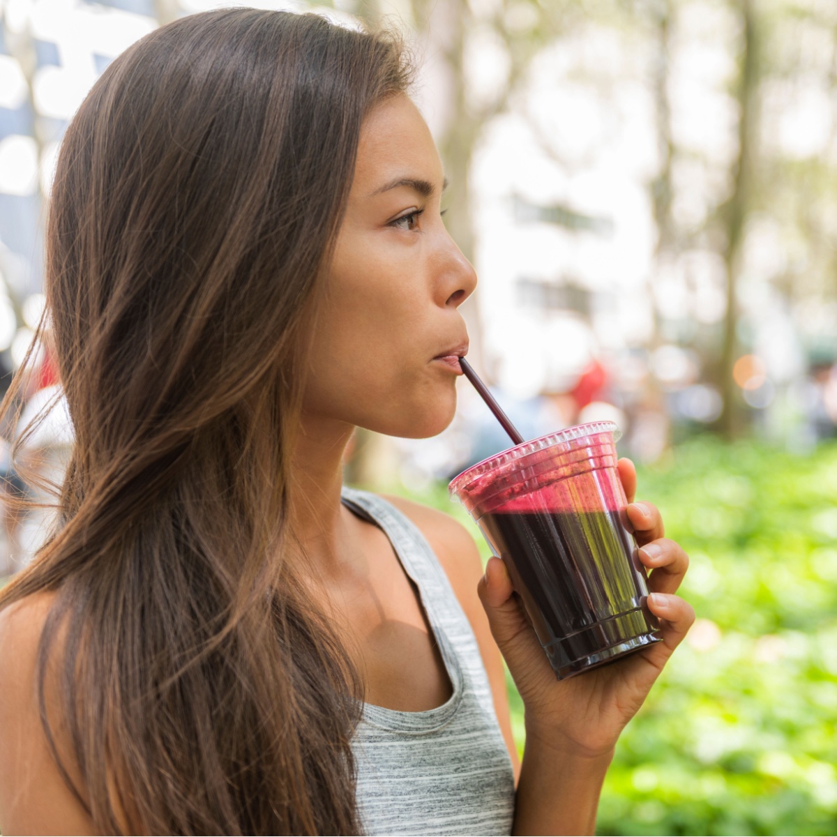 woman drinking smoothie