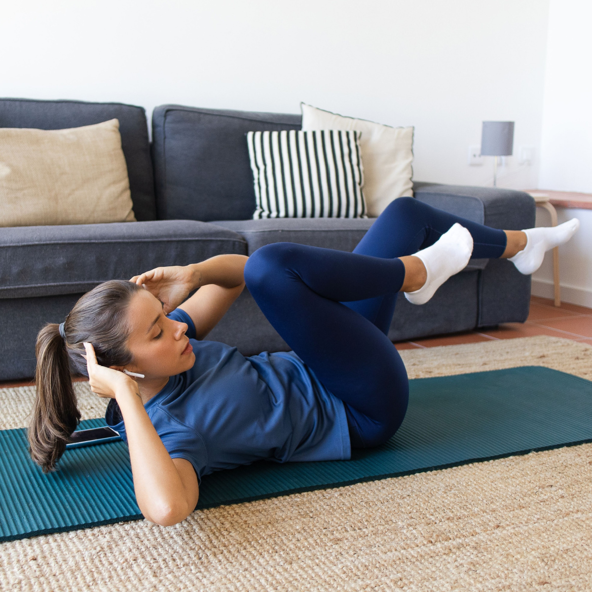 young female doing bicycle crunches