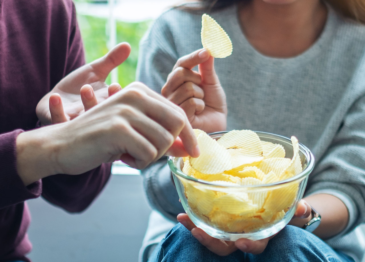 people eating potato chips