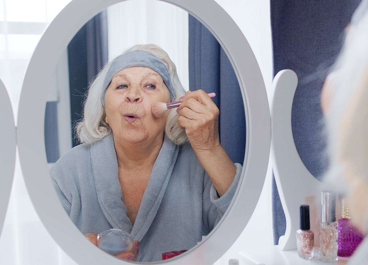 senior-woman-doing-makeup