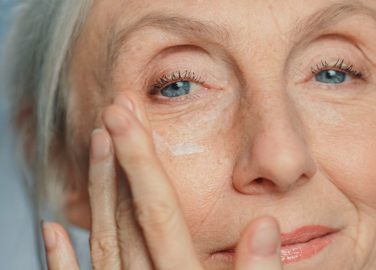 woman-applying-eye-cream