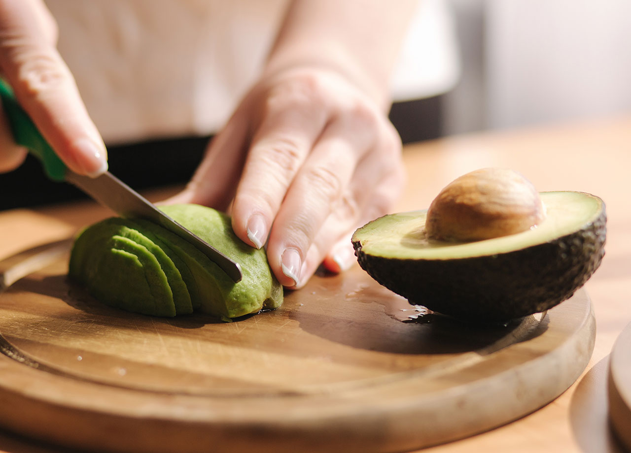 woman-slicing-avocado