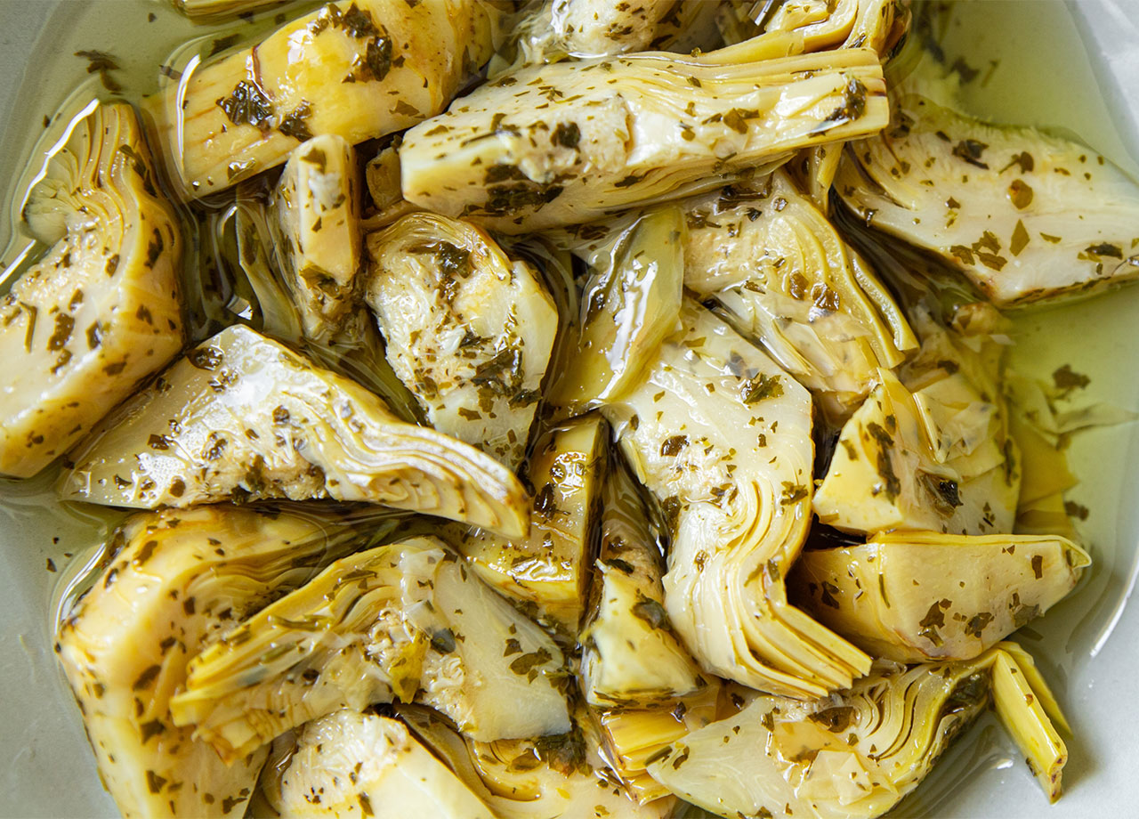 canned marinated artichokes in a bowl