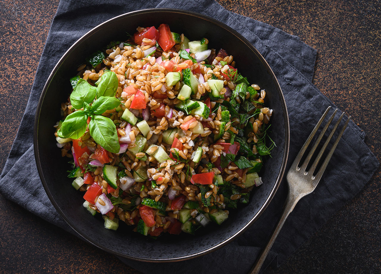salad of whole grain cereal spelt with seasonal vegetables