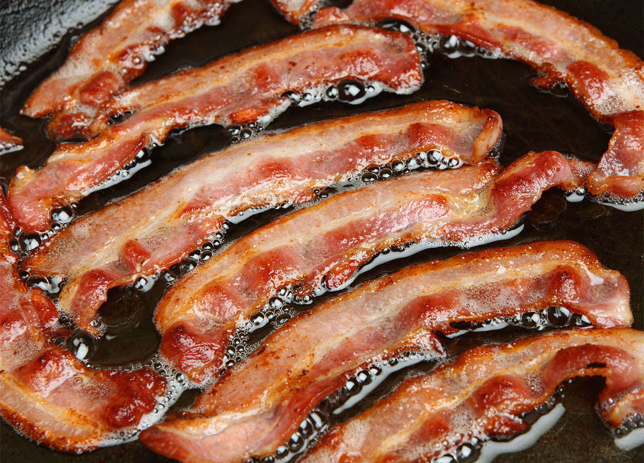 bacon cooking in grease