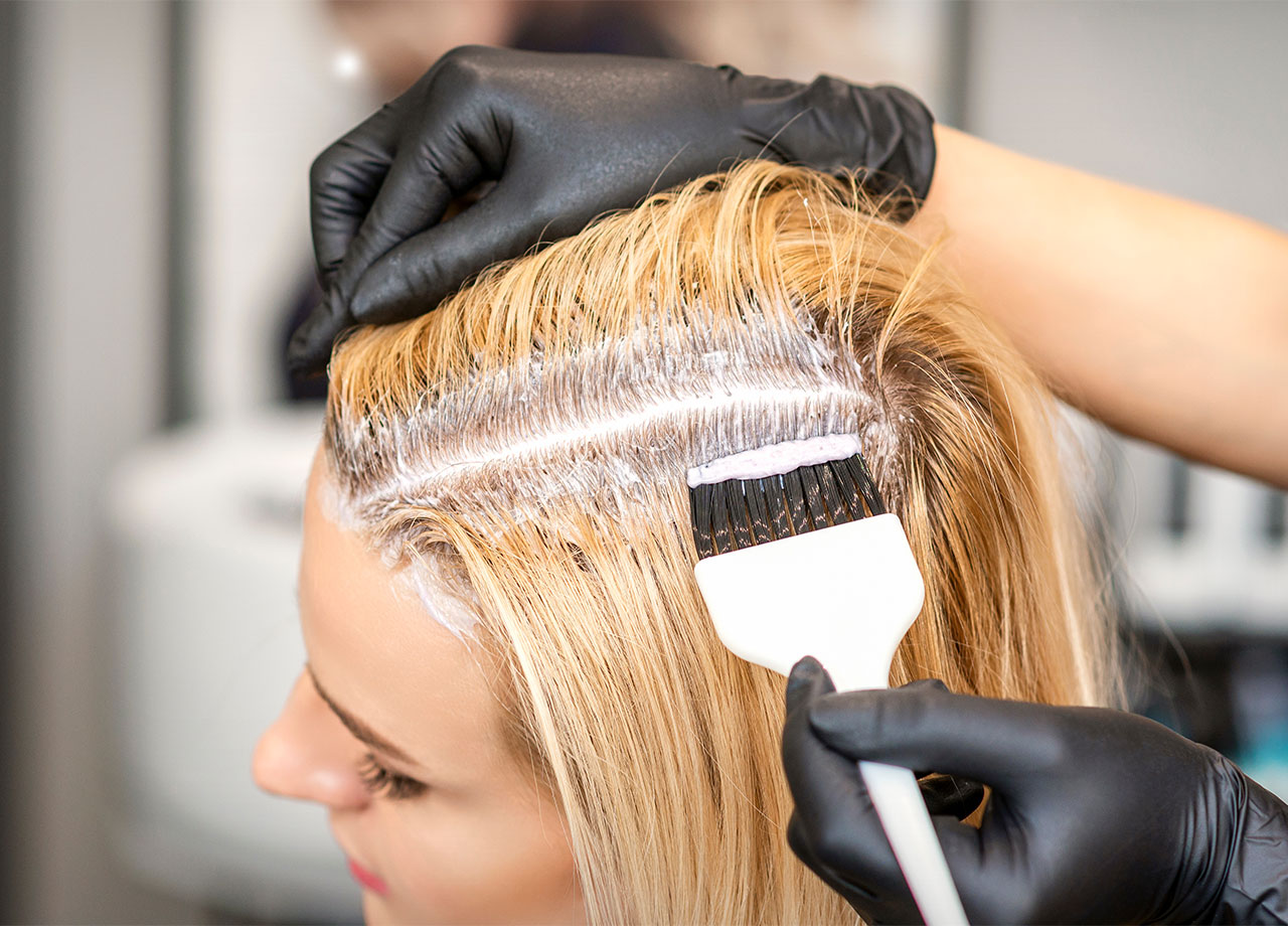 Woman getting her roots bleached