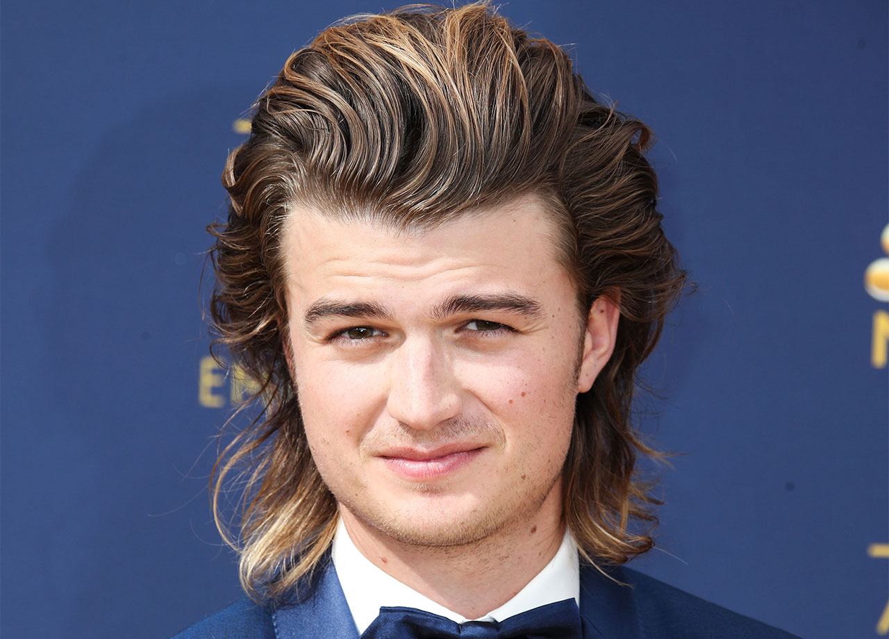 80s backcombed mullet on joe keery