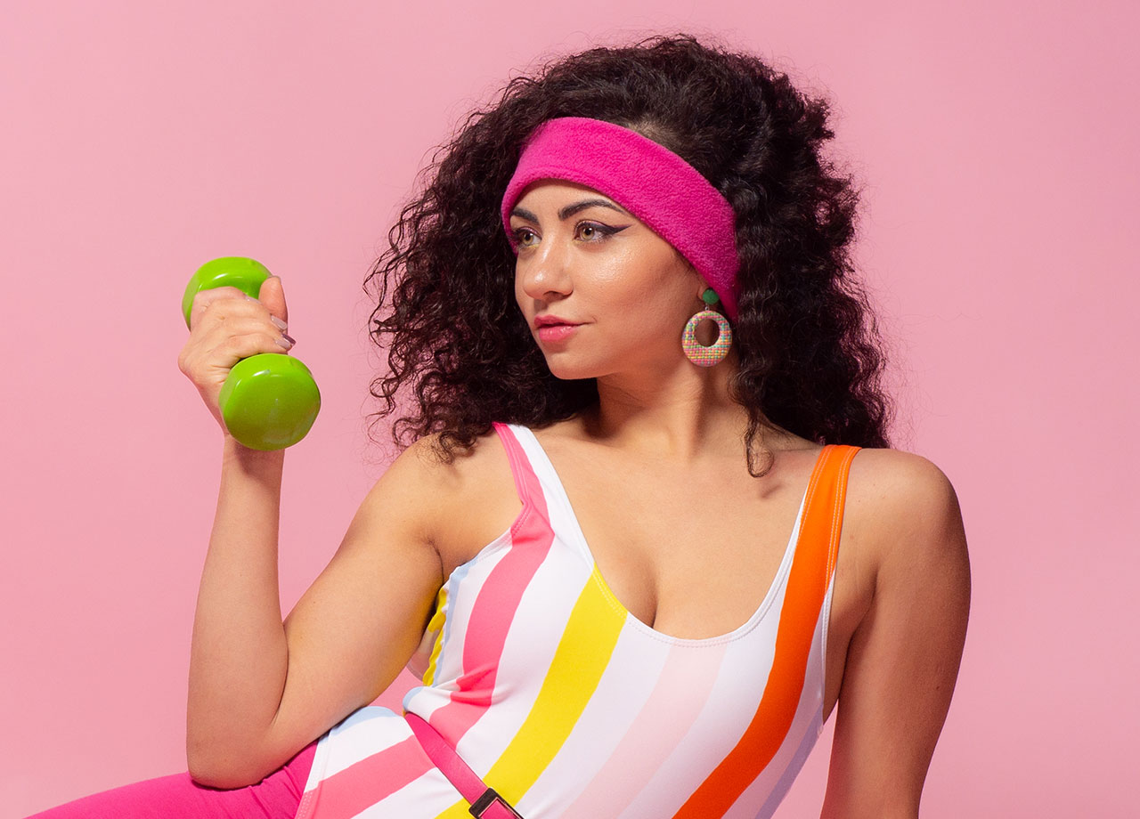 woman working out with 80s headband style