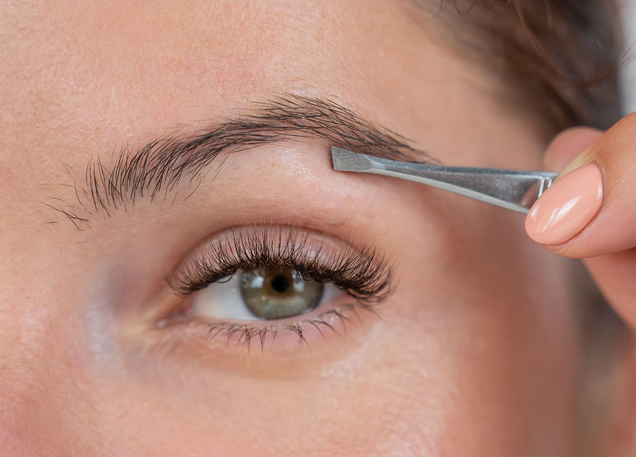 woman-shaping-brows-high-arch