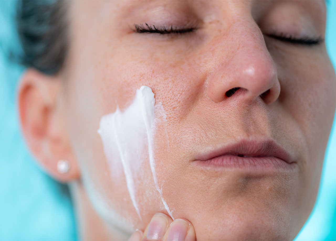 woman-applying-facial-cream