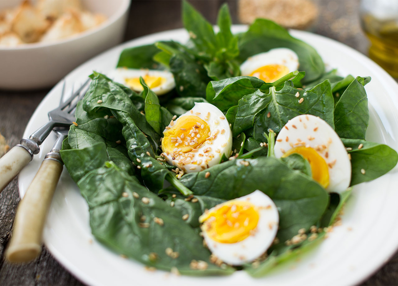 hard boiled eggs on a bed of spinach