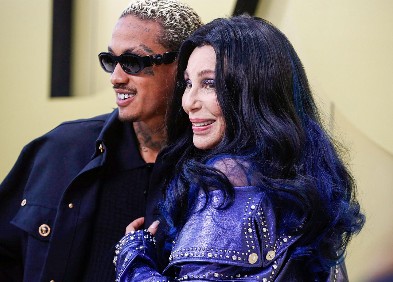 cher and ae at versace show purple-metallic jacket