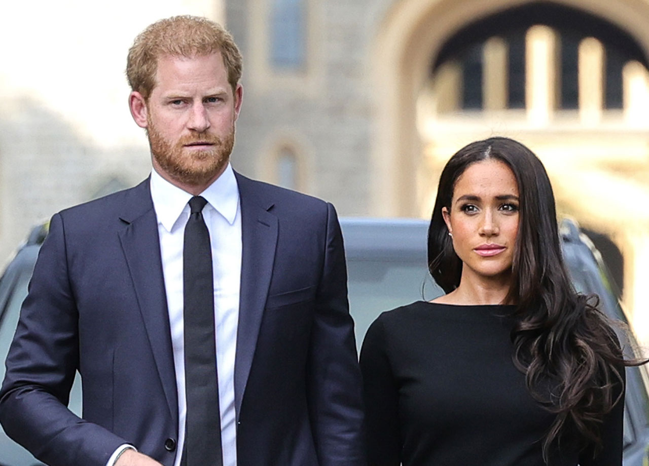 Prince Harry and Meghan Markle look at floral tributes at Windsor Castle