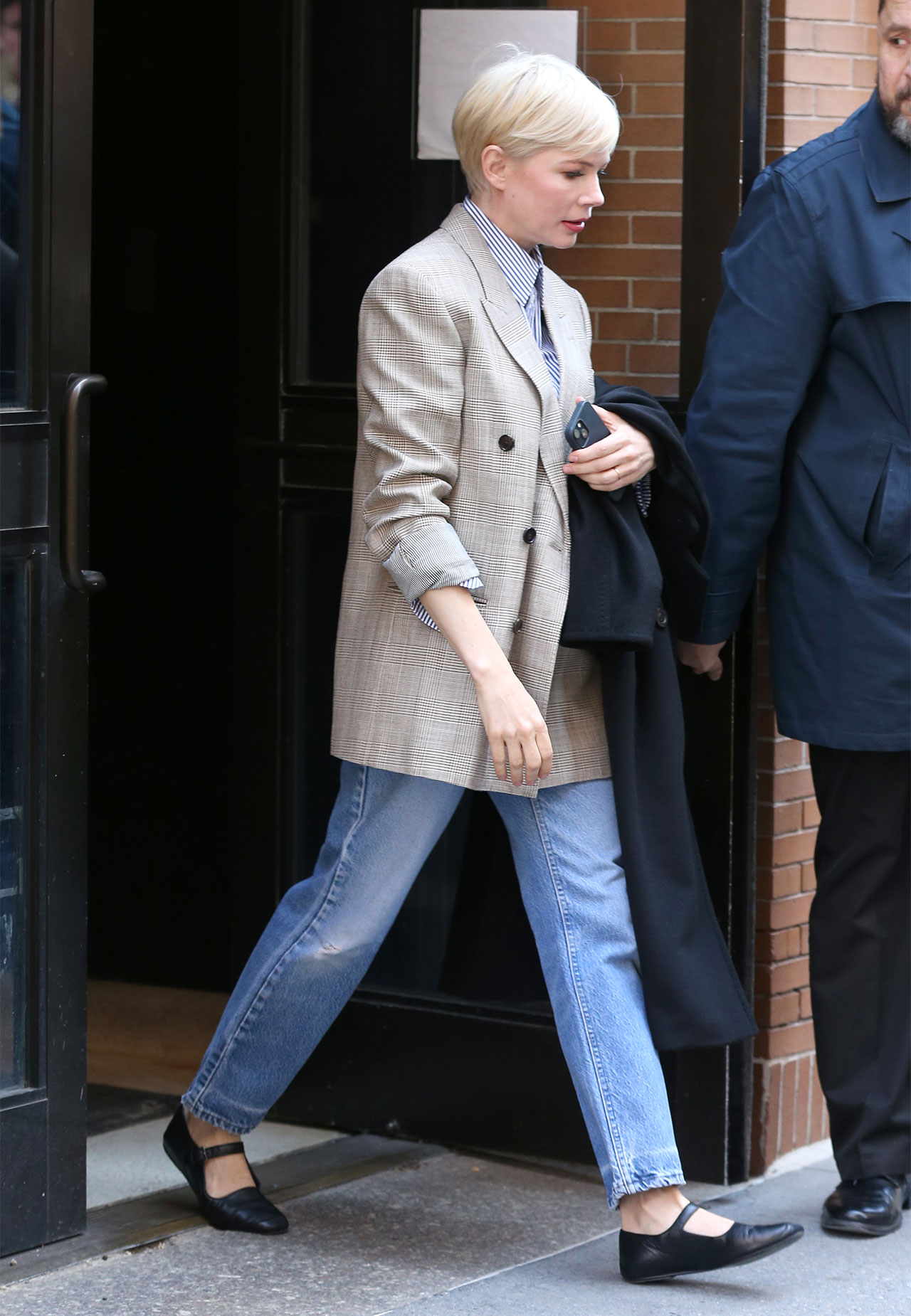 Michelle Williams leaves The View wearing black Mary Jane shoes