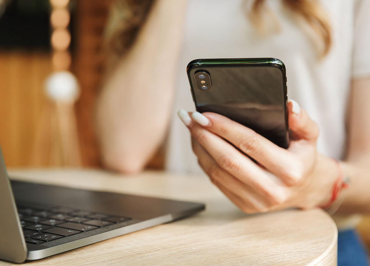 young-woman-holding-iphone