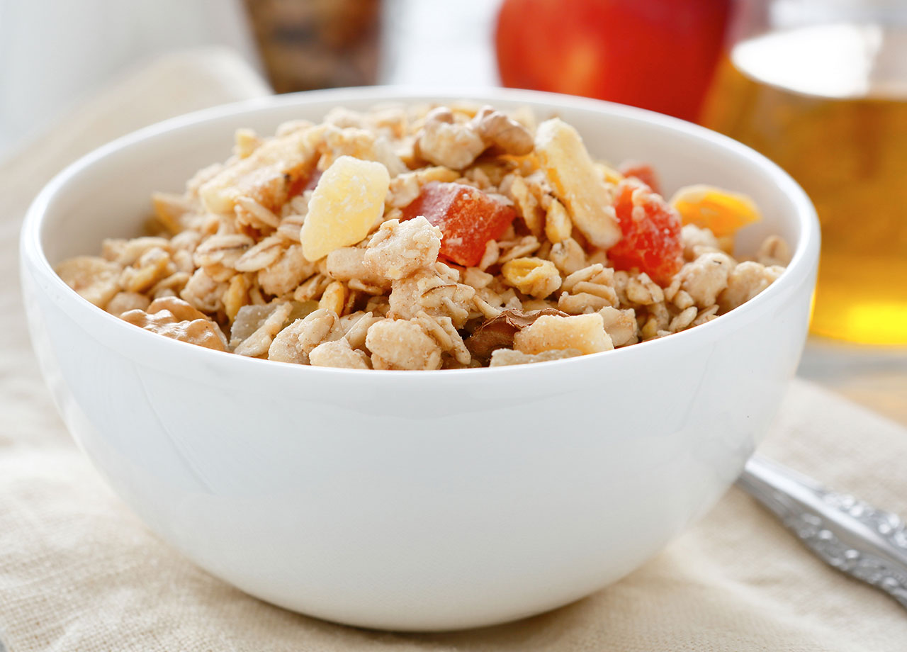 bowl of sugary granola with dried fruit