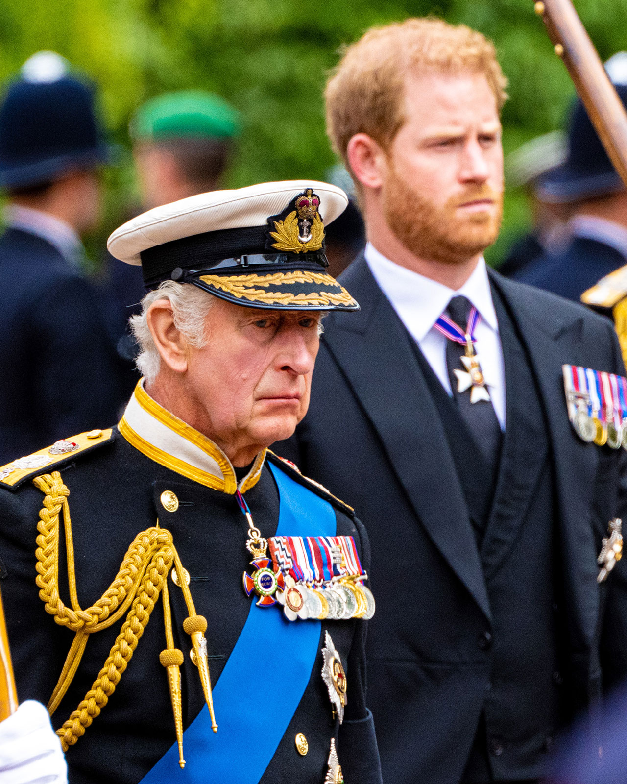 King Charles and Prince Harry looking serious