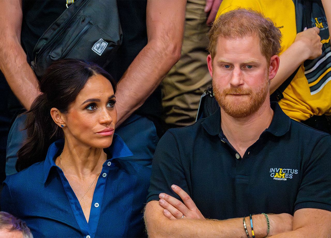 Prince Harry and Meghan Markle looking sad