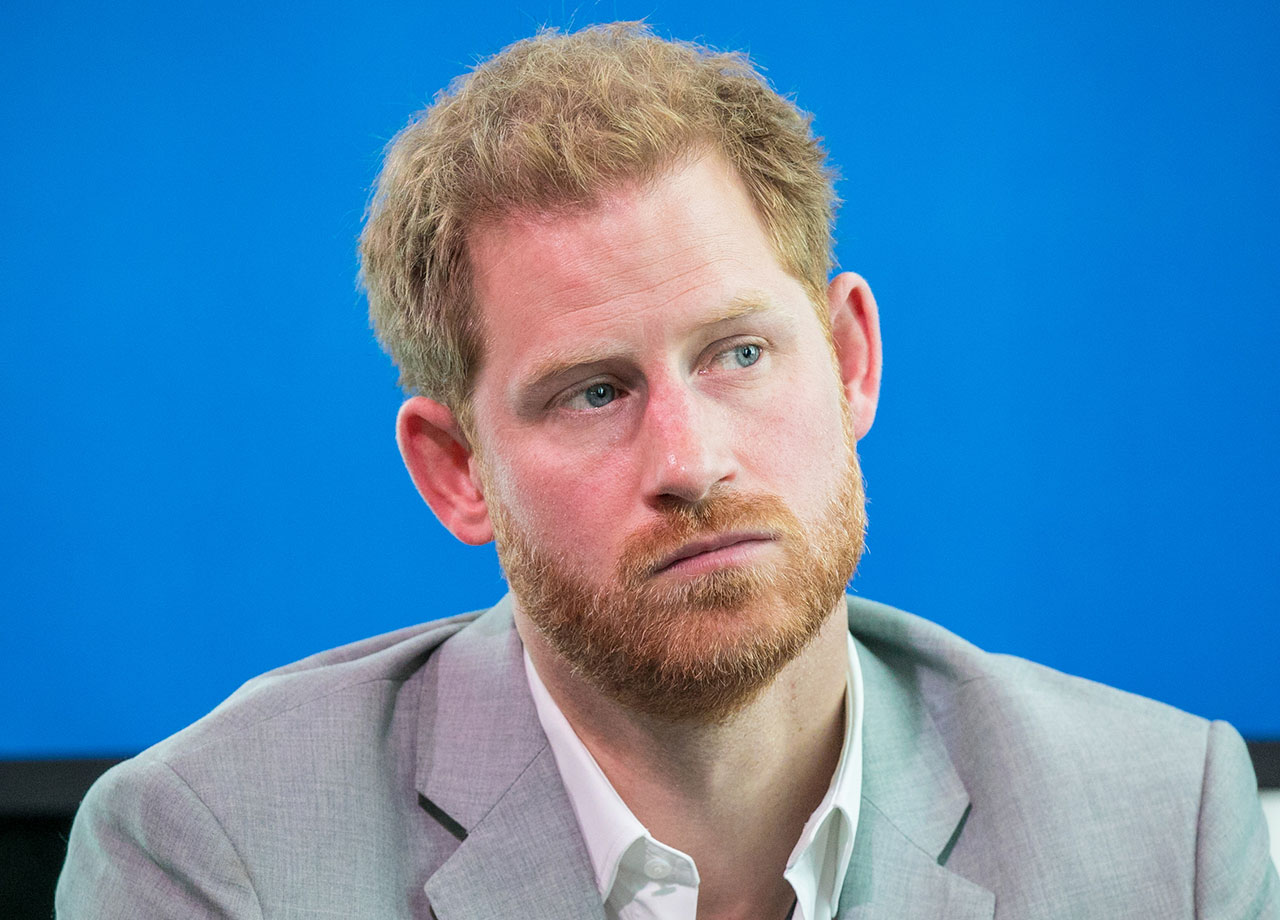 Prince Harry looking sad into the distance