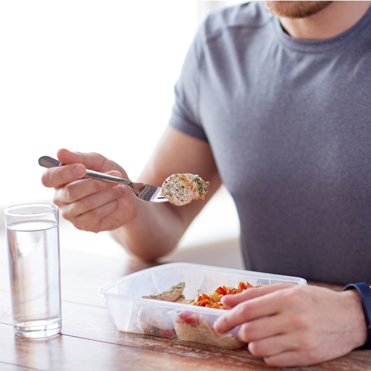 man eating chicken