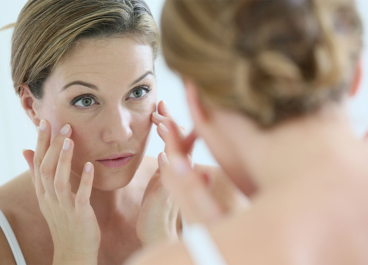 woman-checking-skin-mirror