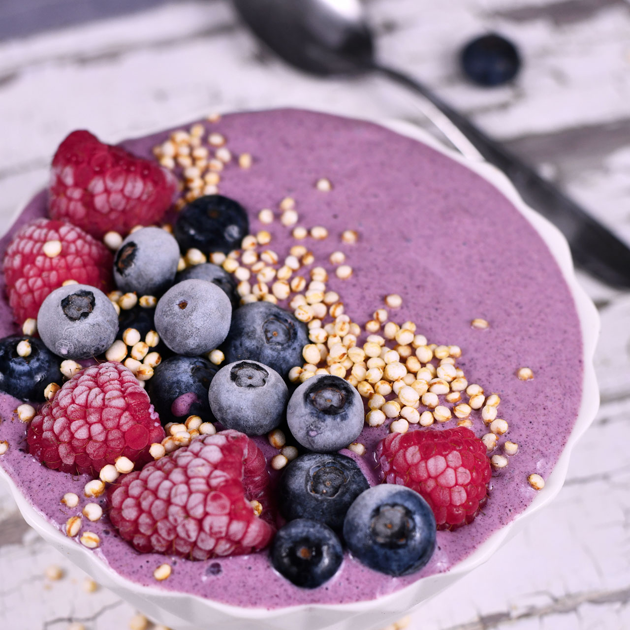 yogurt bowl with berries and puffed quinoa